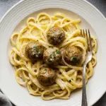 Garlic Butter Meatballs over Creamy Parmesan Linguine