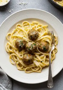 Garlic Butter Meatballs over Creamy Parmesan Linguine